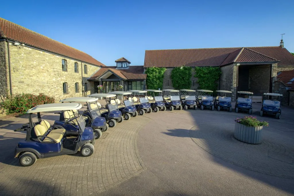 fleet of buggies organised in a semicircle outside of golf club in bristol