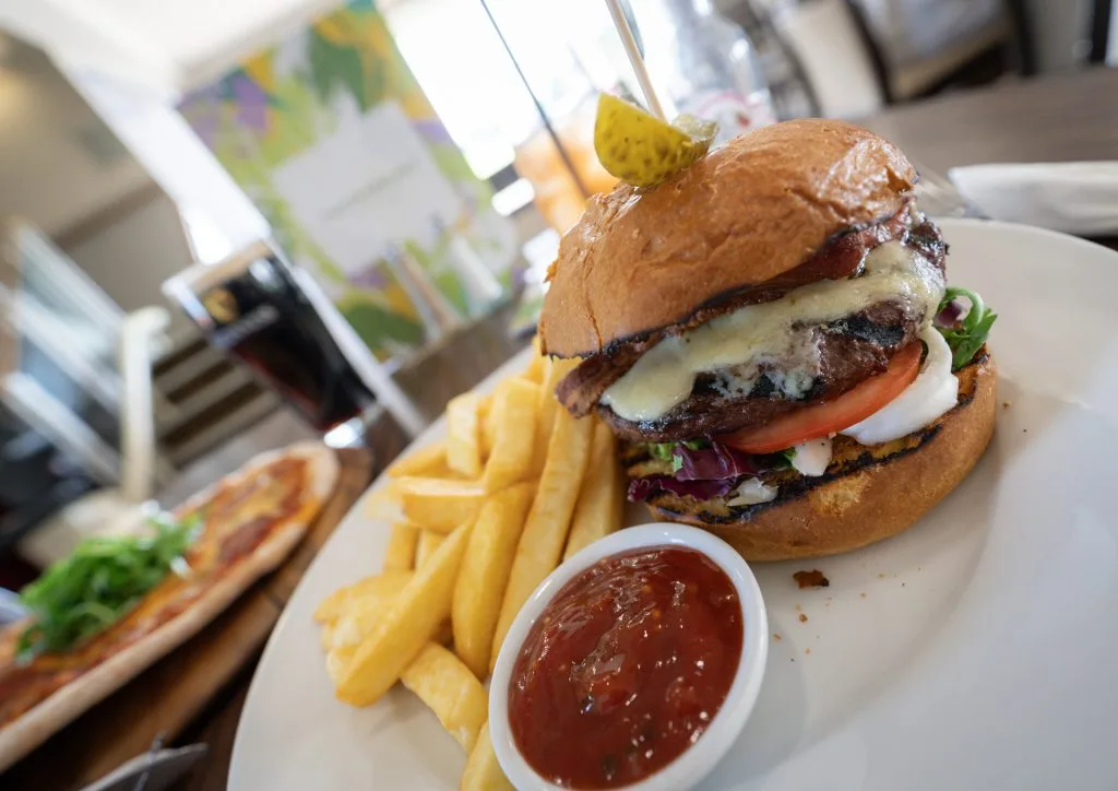 juicy burger and chips at restaurant in bristol