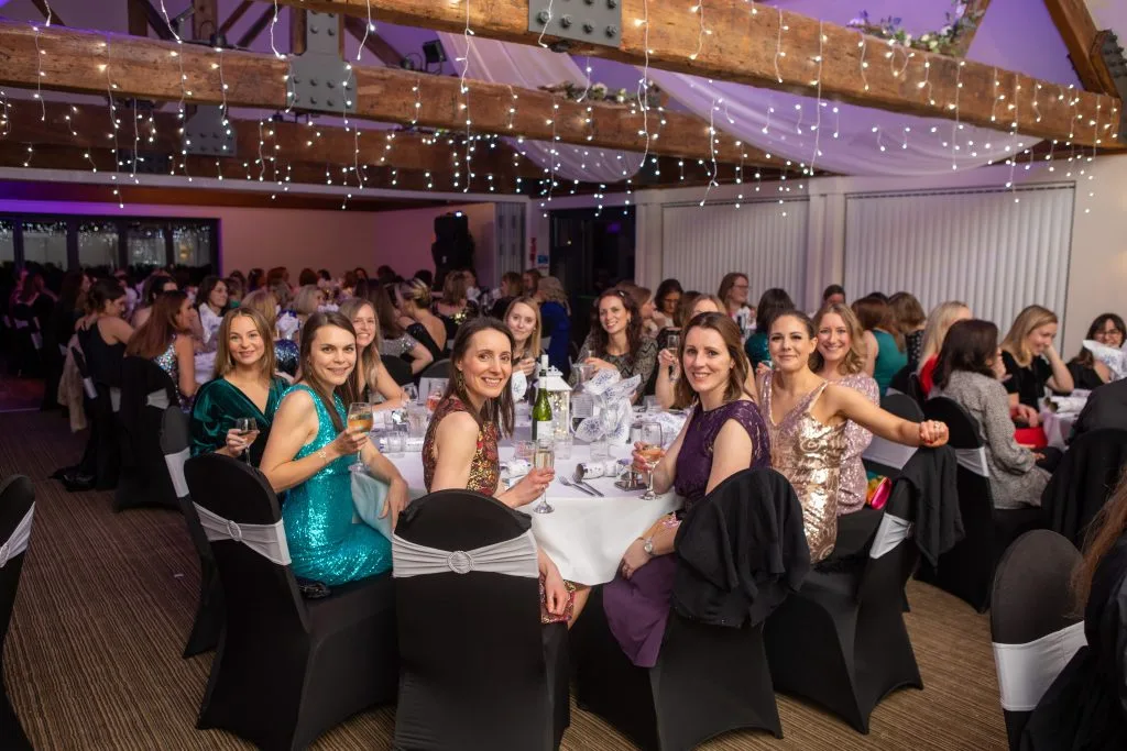 busy room with christmas decorations during a christmas party in bristol